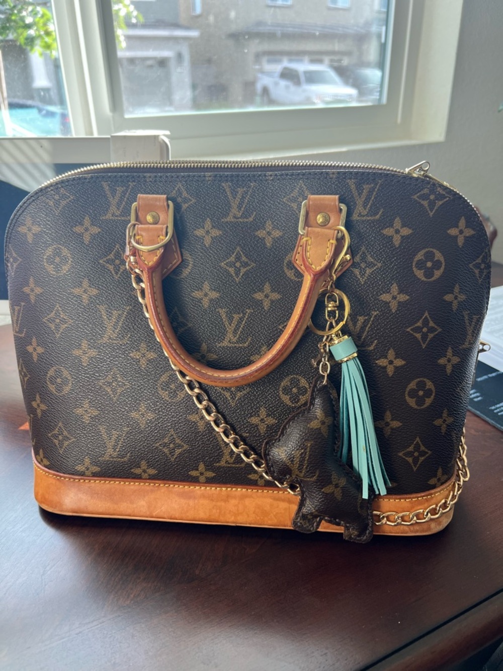 Louis Vuitton Brown Monogram Alma Bag with Turquoise Tassel